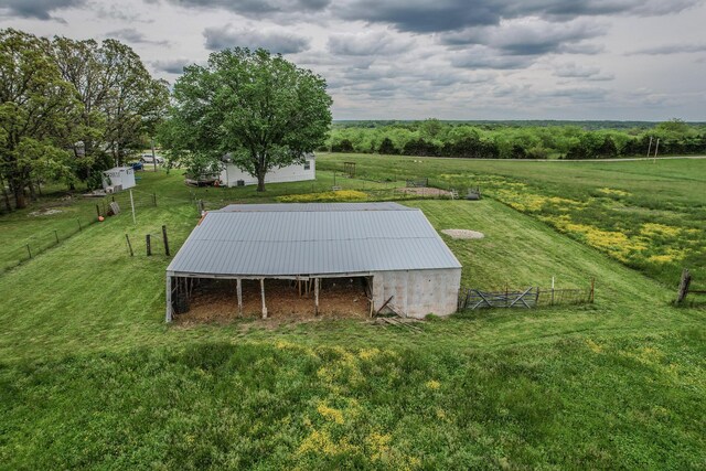 view of pole building featuring a rural view