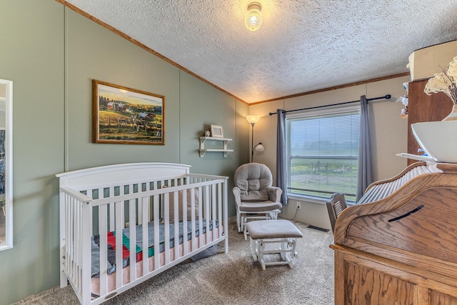 carpeted bedroom with ornamental molding and a textured ceiling