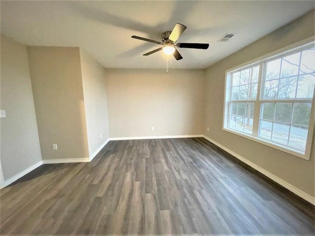 335 Mccann Rd, Powersite, MO 65731 - spare room featuring dark wood-style flooring, baseboards, and ceiling fan