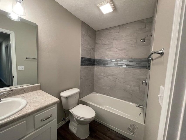 335 Mccann Rd, Powersite, MO 65731 - full bathroom with vanity, toilet, wood finished floors, bathtub / shower combination, and a textured ceiling