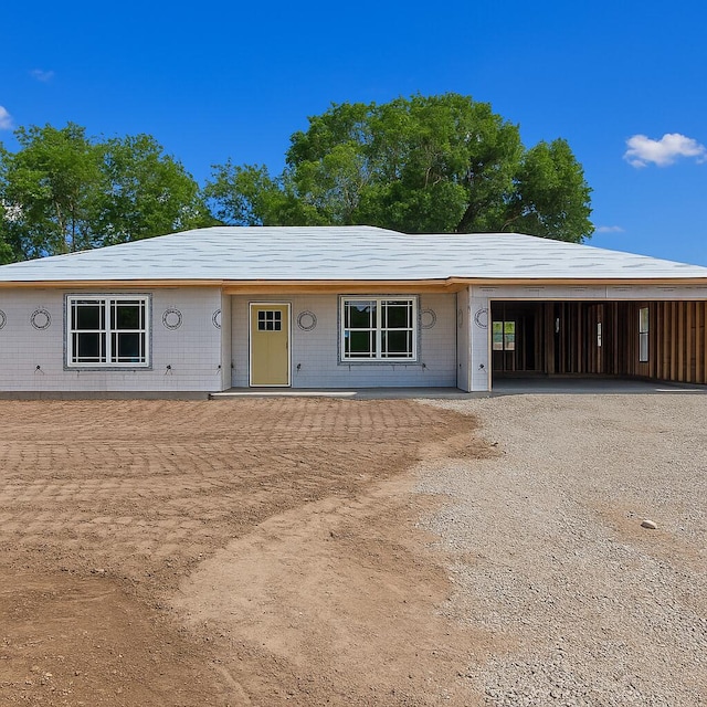 335 Mccann Rd, Powersite, MO 65731 - view of front facade with gravel driveway and an attached garage