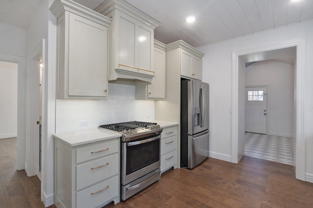 kitchen with stainless steel appliances, dark wood-type flooring, light countertops, baseboards, and wood ceiling