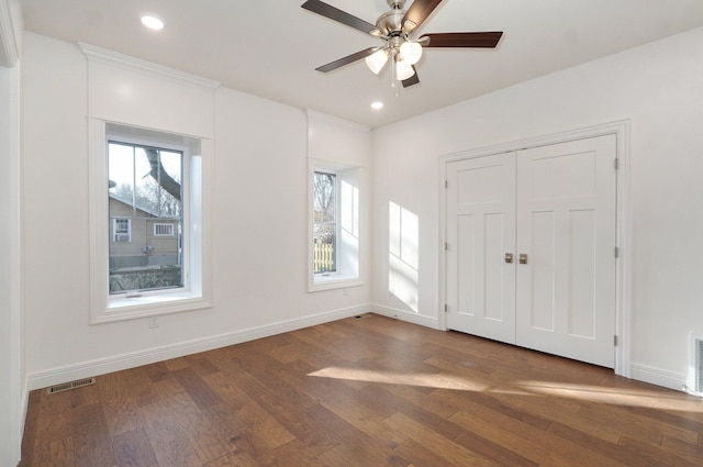 foyer entrance with plenty of natural light, wood finished floors, baseboards, and recessed lighting