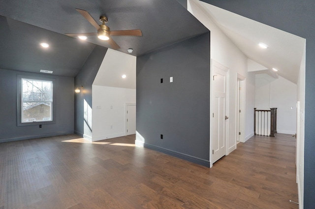 bonus room featuring lofted ceiling, a ceiling fan, wood finished floors, and baseboards