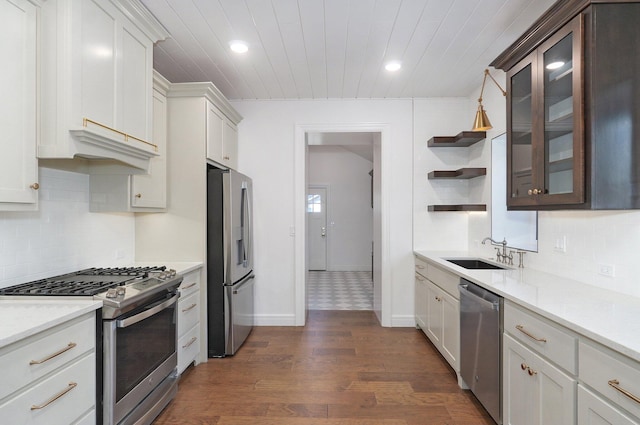 kitchen featuring appliances with stainless steel finishes, a sink, wooden ceiling, open shelves, and glass insert cabinets