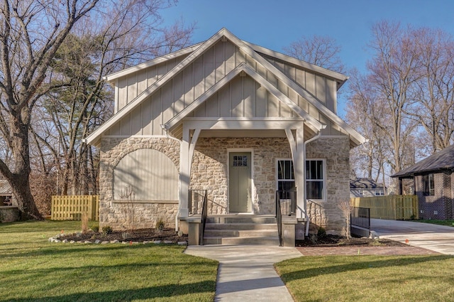 view of front facade featuring stone siding and board and batten siding