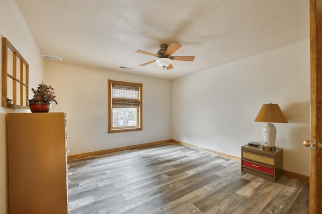 5425 S Westwood Ave, Springfield, MO 65810 - unfurnished room featuring ceiling fan, wood finished floors, and baseboards