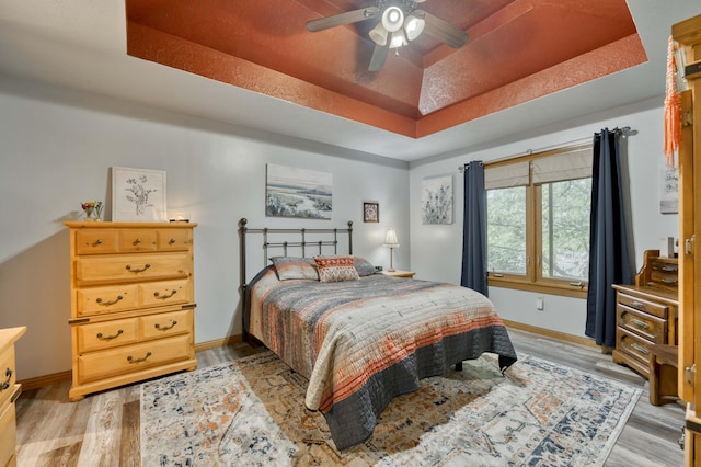 5425 S Westwood Ave, Springfield, MO 65810 - bedroom with a raised ceiling, light wood finished floors, baseboards, and ceiling fan