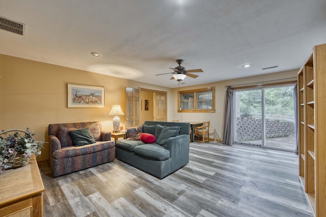 5425 S Westwood Ave, Springfield, MO 65810 - living area with wood finished floors, ceiling fan, baseboards, and recessed lighting