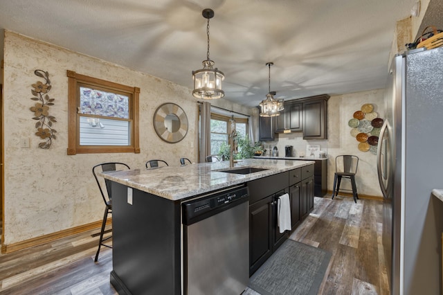 5425 S Westwood Ave, Springfield, MO 65810 - kitchen with appliances with stainless steel finishes, a sink, a kitchen island with sink, and dark wood-style floors