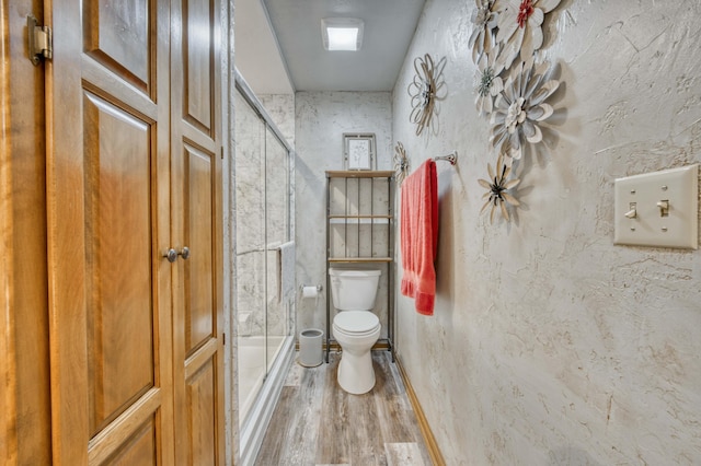 5425 S Westwood Ave, Springfield, MO 65810 - bathroom featuring an enclosed shower, toilet, and wood finished floors