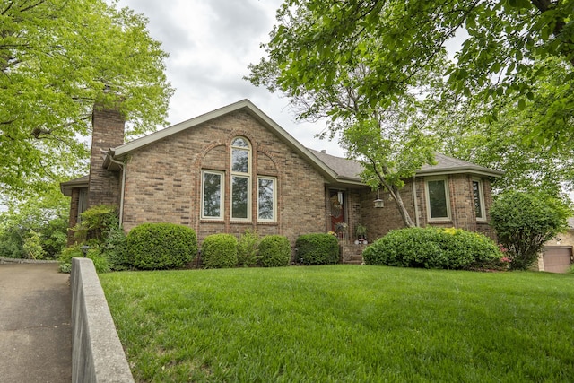 5425 S Westwood Ave, Springfield, MO 65810 - view of front of house featuring a chimney, a front lawn, and brick siding