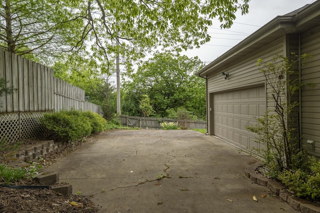 5425 S Westwood Ave, Springfield, MO 65810 - view of patio / terrace featuring fence and a garage