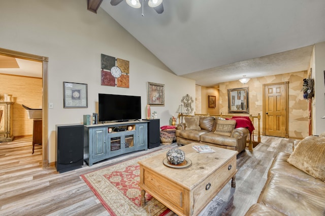 5425 S Westwood Ave, Springfield, MO 65810 - living area featuring light wood-style floors, a ceiling fan, high vaulted ceiling, and beam ceiling