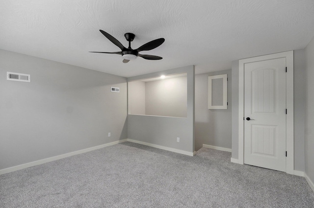610 Chicago Ave, Marionville, MO 65705 - carpeted empty room with baseboards, a ceiling fan, and a textured ceiling