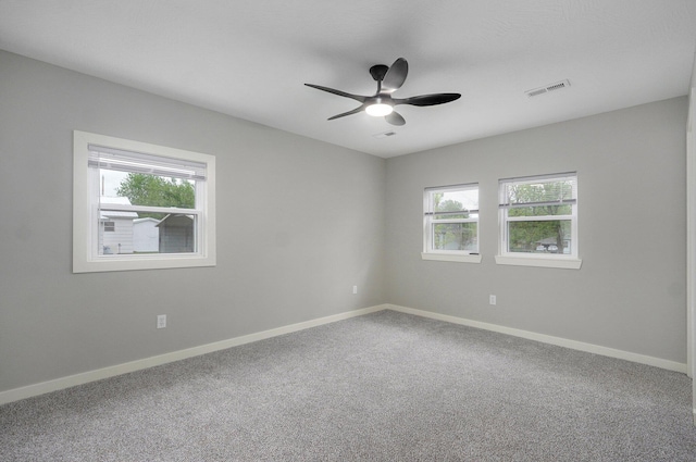 610 Chicago Ave, Marionville, MO 65705 - unfurnished room featuring plenty of natural light, carpet flooring, ceiling fan, and baseboards
