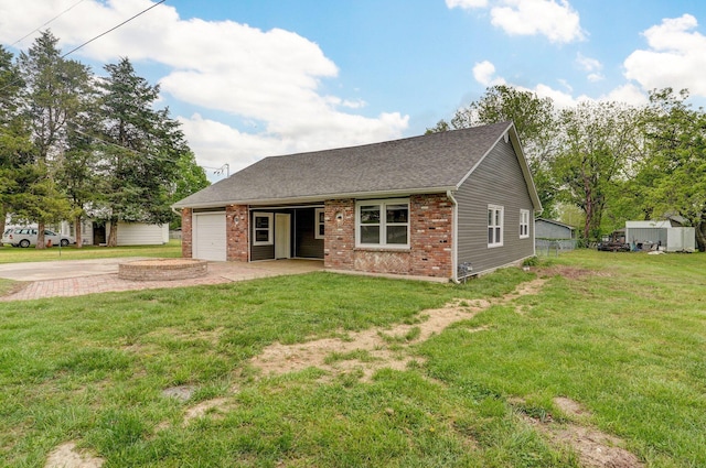 610 Chicago Ave, Marionville, MO 65705 - view of front facade with a garage, driveway, brick siding, and a shingled roof