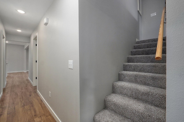 610 Chicago Ave, Marionville, MO 65705 - staircase featuring wood finished floors, recessed lighting, and baseboards