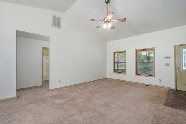 unfurnished living room featuring high vaulted ceiling, carpet flooring, plenty of natural light, and ceiling fan