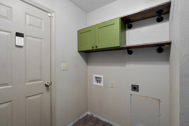 washroom featuring cabinet space, dark wood finished floors, washer hookup, electric dryer hookup, and a textured ceiling
