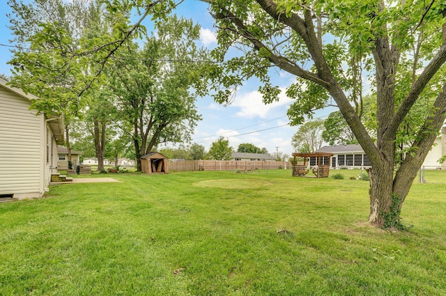 view of yard featuring a storage unit and an outdoor structure