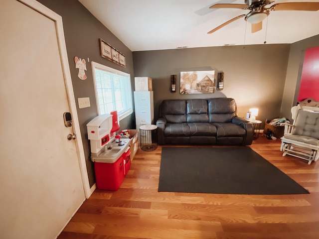 310 W Delta St, Aurora, MO 65605 - living area with wood finished floors and ceiling fan