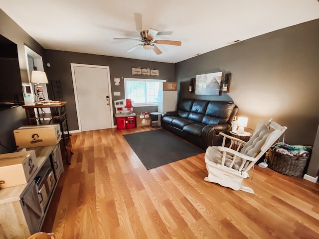 310 W Delta St, Aurora, MO 65605 - living area featuring a ceiling fan and light wood-type flooring
