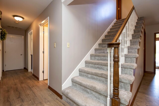 1918 E Buena Vista St, Springfield, MO 65804 - stairs with wood finished floors and baseboards