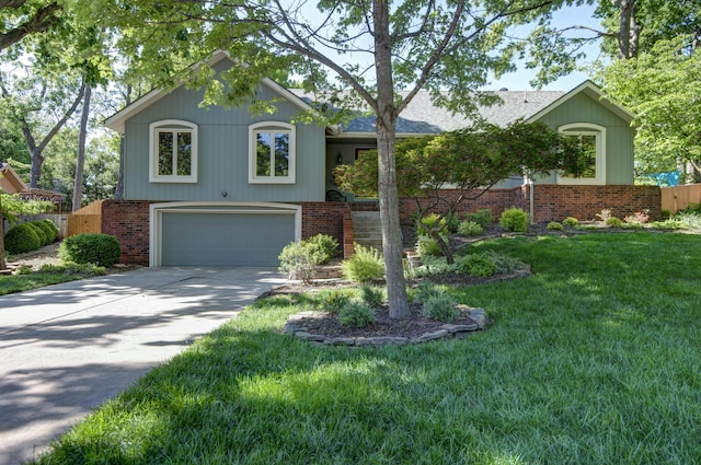 1918 E Buena Vista St, Springfield, MO 65804 - view of front of house with a garage, concrete driveway, brick siding, and a front yard