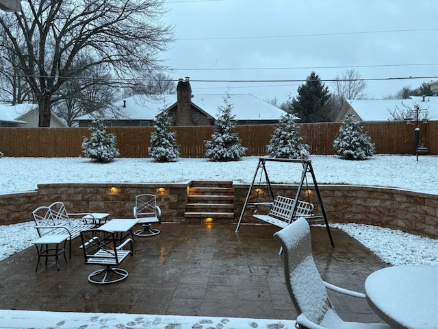 1918 E Buena Vista St, Springfield, MO 65804 - snow covered patio featuring a fenced backyard and a patio