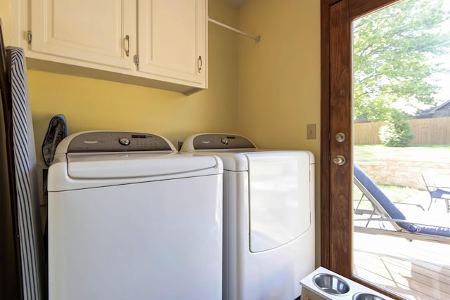 1918 E Buena Vista St, Springfield, MO 65804 - laundry room featuring cabinet space, independent washer and dryer, and plenty of natural light