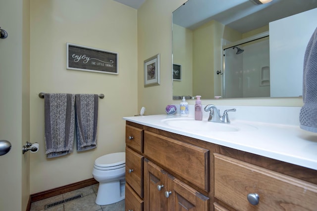 1918 E Buena Vista St, Springfield, MO 65804 - bathroom featuring a stall shower, toilet, baseboards, and vanity