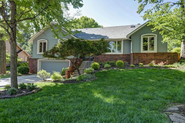 1918 E Buena Vista St, Springfield, MO 65804 - view of front of home featuring brick siding, concrete driveway, a front yard, a garage, and a shingled roof