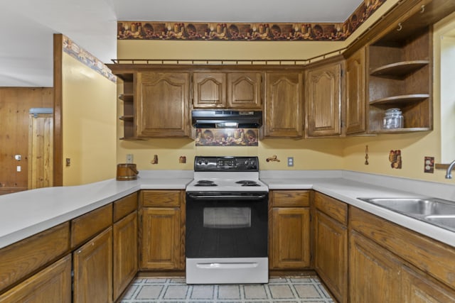 kitchen featuring open shelves, range with electric stovetop, under cabinet range hood, light countertops, and brown cabinetry