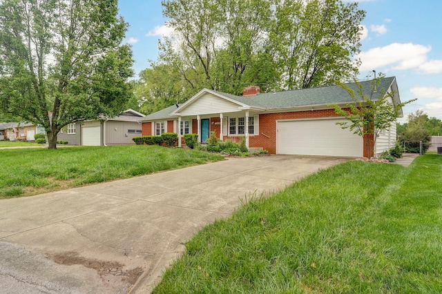 ranch-style home featuring an attached garage, concrete driveway, a front yard, a chimney, and brick siding