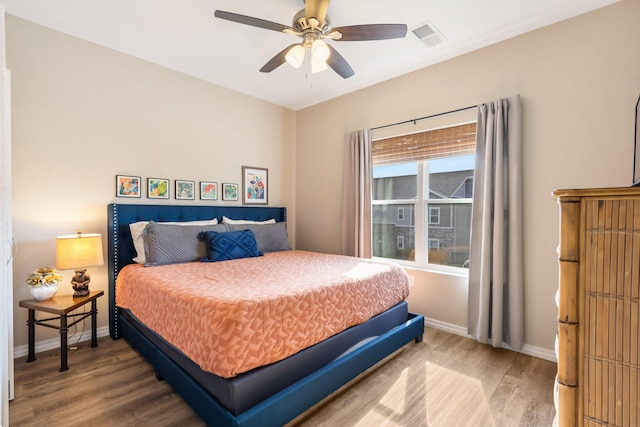 3112 S Vinyards Terrace Parkway Unit 4, Branson, MO 65616 - bedroom with wood finished floors, baseboards, and a ceiling fan
