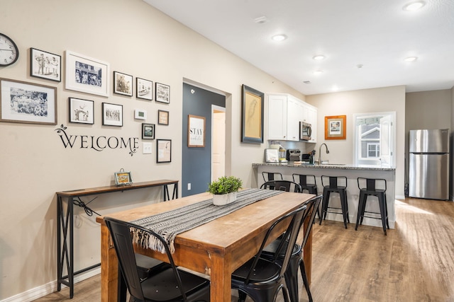 3112 S Vinyards Terrace Parkway Unit 4, Branson, MO 65616 - dining area with light wood-style flooring, recessed lighting, and baseboards