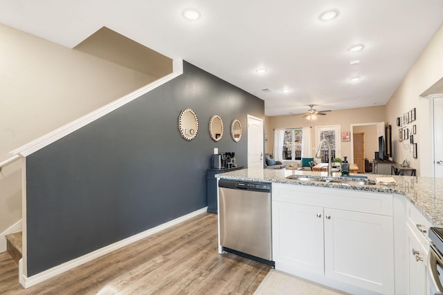 3112 S Vinyards Terrace Parkway Unit 4, Branson, MO 65616 - kitchen featuring appliances with stainless steel finishes, a sink, light wood finished floors, ceiling fan, and white cabinets