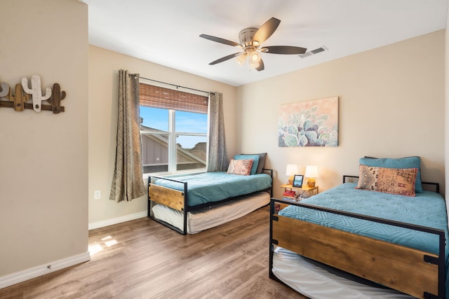 3112 S Vinyards Terrace Parkway Unit 4, Branson, MO 65616 - bedroom with wood finished floors, baseboards, and ceiling fan