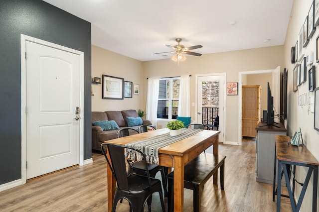 3112 S Vinyards Terrace Parkway Unit 4, Branson, MO 65616 - dining room with a ceiling fan, light wood-type flooring, and baseboards