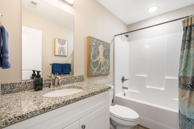 3112 S Vinyards Terrace Parkway Unit 4, Branson, MO 65616 - bathroom featuring toilet, shower / bath combo with shower curtain, and vanity