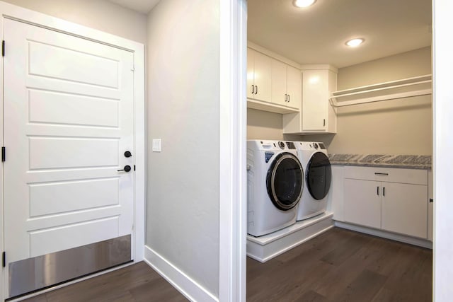 washroom with washing machine and clothes dryer, dark wood-style floors, cabinet space, baseboards, and recessed lighting