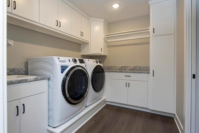 washroom featuring washer and dryer, cabinet space, dark wood finished floors, and recessed lighting