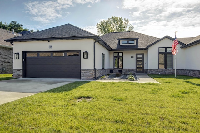view of front of home featuring stone siding, stucco siding, a front yard, and an attached garage