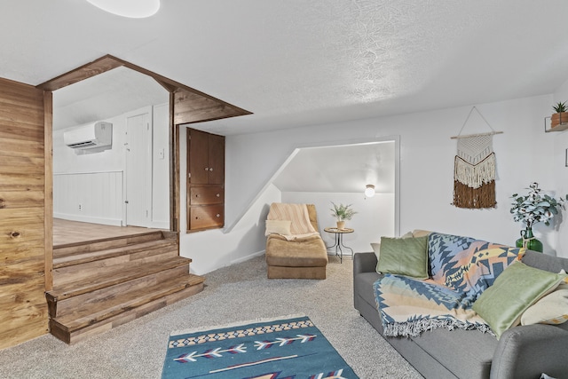 311 S Center St, Fordland, MO 65652 - carpeted living area featuring an AC wall unit, a textured ceiling, and stairs