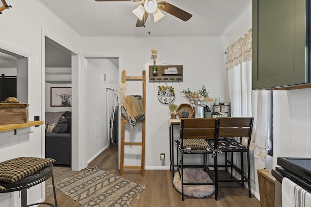 311 S Center St, Fordland, MO 65652 - dining area featuring a ceiling fan, wood finished floors, and crown molding