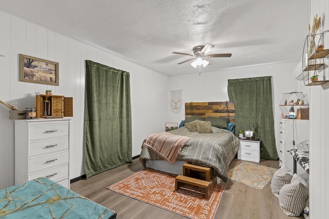 311 S Center St, Fordland, MO 65652 - bedroom with wood finished floors, a textured ceiling, and ceiling fan