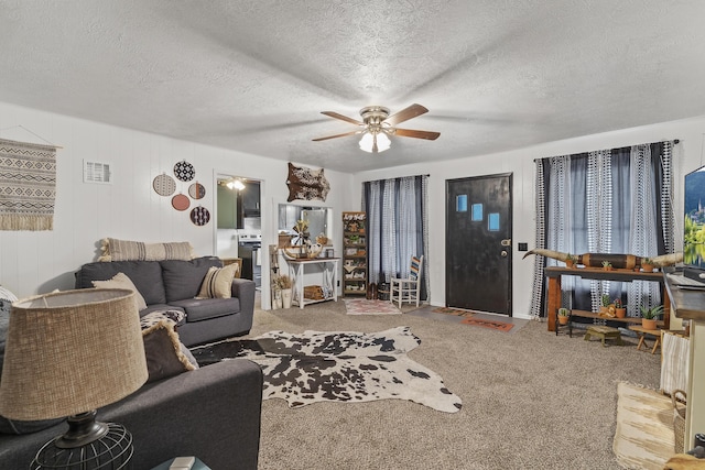 311 S Center St, Fordland, MO 65652 - carpeted living area featuring ceiling fan and a textured ceiling