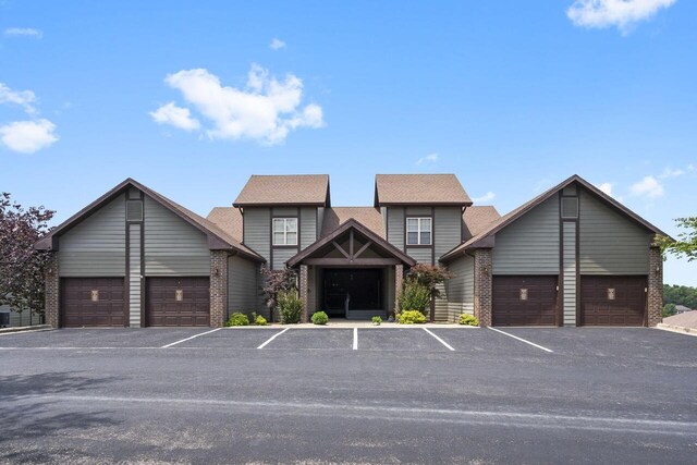 71 Birdie Ln Unit 3, Branson West, MO 65737 - craftsman-style home with brick siding and uncovered parking