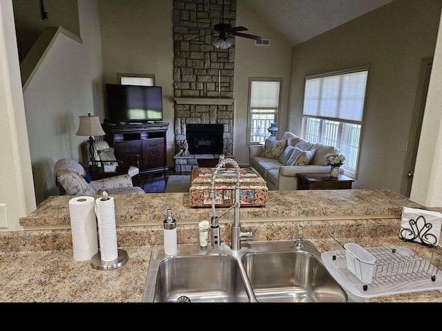 71 Birdie Ln Unit 3, Branson West, MO 65737 - living room with a ceiling fan, vaulted ceiling, and a fireplace